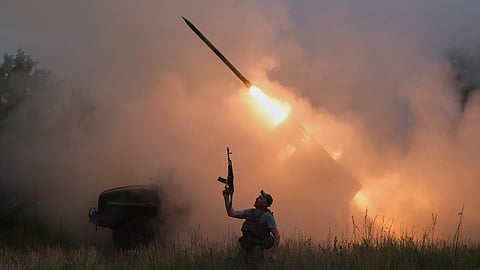 In this photo provided by Ukraine's 93rd Kholodnyi Yar Separate Mechanized Brigade press service, a soldier reacts as an MRLS BM-21 "Grad" fires at the Russian positions near Kostiantynivka, Donetsk region, Ukraine, Thursday, June 4, 2026.