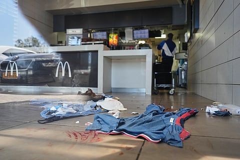 Blood stains are visible at the scene of what Israeli police say was a series of shooting attacks in Kochav Yair, central Israel, Sunday, June 7, 2026. 
