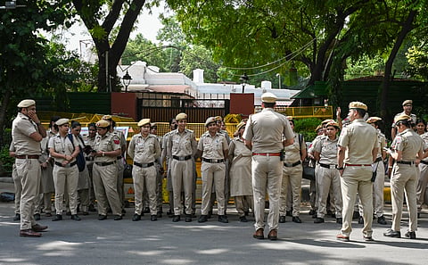 Police personnel stand guard outside Union Education Minister Dharmendra Pradhans residence, as Cockroach Janta Party begins a protest at Jantar Mantar demanding Pradhans resignation on Saturday, June 6, 2026.