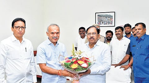 BJP MLAs B Suresh Gowda and G B Jyothiganesh greet DCM Dr G Parameshwara in Tumakuru on Sunday.