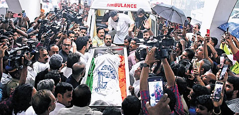 Senior Congress leaders drape the Indian National Congress flag on the mortal remains of actor Salim Kumar outside Paravur Town Hall on Sunday 