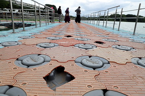 Damaged floating bridge in Valankulam lake in Coimbatore on Sunday.