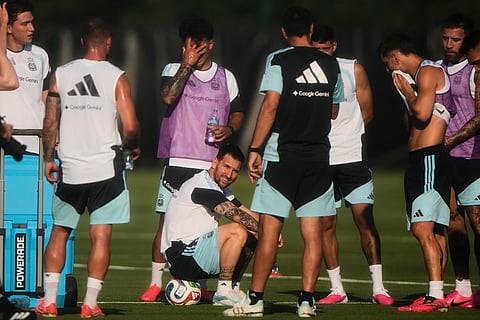 Argentina forward Lionel Messi, sitting, take a break with teammates during practice for the FIFA World Cup soccer, Wednesday, June 3, 2026, in Kansas City, Kan.
