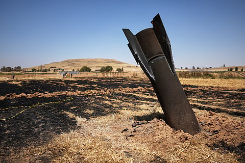 A projectile is seen in a burned agricultural field near the town of Najha, Syria, Monday, June 8, 2026, after debris from Iranian missile launches during the Iran-Israel conflict fell in the area.