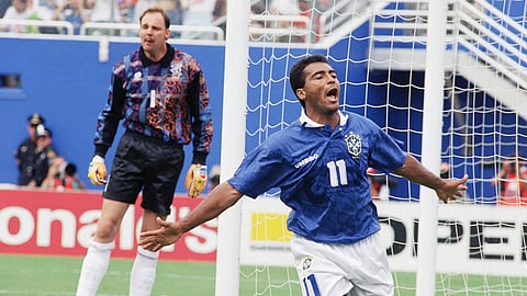 Brazil's Romario (11) celebrates after scoring Brazil's first goal as Netherlands' goalkeeper Ed De Goej  looks on during the second half of a World Cup quarterfinal soccer match at the Cotton Bowl in Dallas, Texas, Saturday, July 9, 1994.