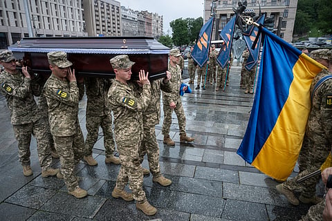 Ukrainian servicemen carry the coffin of fallen Ukrainian serviceman of 3rd assault brigade Yaroslav Ivanov during funeral ceremony in Kyiv, Ukraine, Monday, June 8, 2026. 