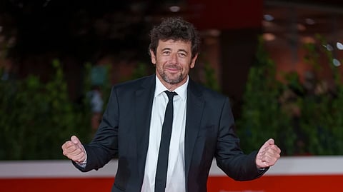 Actor Patrick Bruel poses on the red carpet for the movie ‘Promises’ at the 16th edition of the Rome Film Fest in Rome, Oct. 17, 2021.