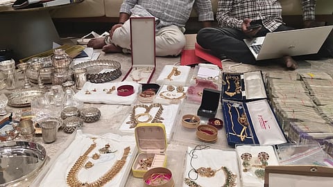 According to sources,  around Rs 65 lakh in cash was recovered during the searches. Officials also seized 15 gold biscuits weighing approximately 1.5 kg.