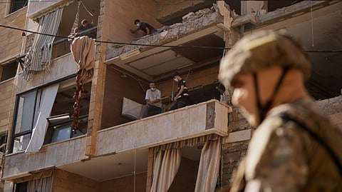 People check destroyed apartments that where hit by an Israeli airstrike in Dahiyeh, Beirut's southern suburb, Lebanon, Sunday, June 7, 2026. 