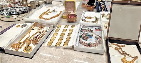 Jewellery and valuables seized from senior R&B Engineer-in-Chief Mohan Naik Jarupla (right) by the ACB, in Hyderabad on Tuesday