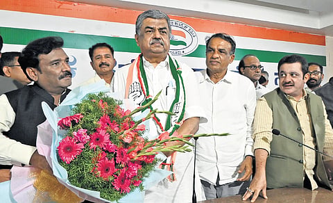 Karnataka Pradesh Congress Committee President BK Hariprasad with others during a press meet at party office in Bengaluru on Wednesday.