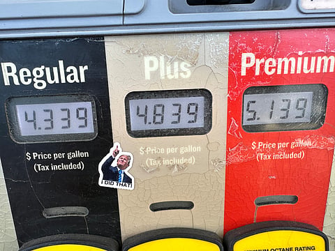 A sticker with the image of President Donald J. Trump points to the electronically-displayed per-gallon prices for the various grades of gasoline available from a pump at a Conoco station Saturday, May 30, 2026, in Denver. 