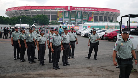 Police officers stand in formation outside the Mexico City Stadium in Mexico City, Wednesday, a day before it hosts the opening FIFA World Cup match between Mexico and South Africa