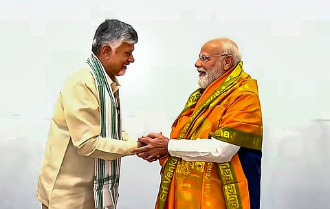 Chief Minister Nara Chandrababu Naidu and Deputy CM Pawan Kalyan congratulate Prime Minister Narendra Modi on completion of 12 years of reign at the NDA meeting in New Delhi on Wednesday.