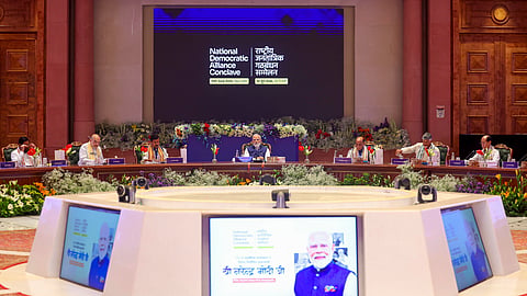 Prime Minister Narendra Modi during the National Democratic Alliance (NDA) Conclave, at the Bharat Mandapam in New Delhi. Union Home Minister Amit Shah, Defence Minister Rajnath Singh, BJP National President Nitin Nabin and others also seen. 