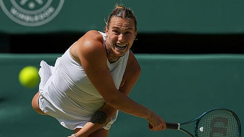 Aryna Sabalenka of Belarus serves to Amanda Anisimova of the US during a women's singles semifinal match at the Wimbledon Tennis Championships in London, Thursday, July 10, 2025.