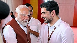 Minister for IT Nara Lokesh greets PM Narendra Modi.