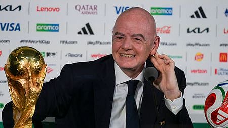 FIFA President Gianni Infantino gestures during a press conference with the World Cup trophy on the eve of the opening match of the 2026 World Cup