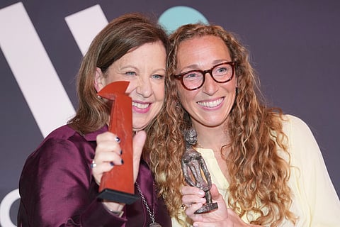 Virginia Evans, right, and Lyse Doucet winners of The Women's Prize for fiction and nonfiction, left, pose for a photograph at the 2026 Women's Prize Trust Summer Party & Awards Ceremony in London, Thursday, June 11, 2026