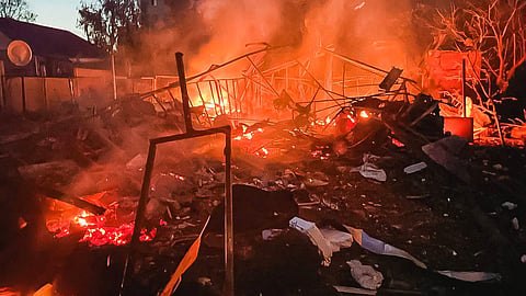 In this photo provided by the Ukrainian Emergency Services on Tuesday, June 9, 2026, a damaged building burns after a Russian strike in Kharkiv, Ukraine.