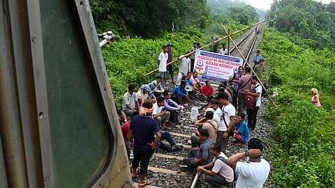 Surrendered members of the National Liberation Front of Tripura (NLFT) and All Tripura Tiger Force (ATTF) block a railway track in protest in the Baramura area, near Agartala, Tripura, on Friday, June 12, 2026.