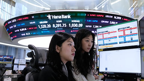 Currency traders watch monitors at the foreign exchange dealing room of the Hana Bank headquarters in Seoul, South Korea, Friday, June 12, 2026