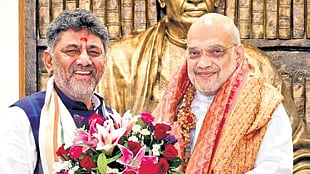 DK Shivakumar with Amit Shah 
in New Delhi on Friday  