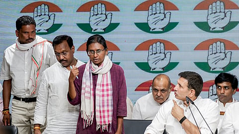 Congress leader Meenakshi Natarajan, centre, speaks as party leader Jitu Patwari, right, looks on during a party briefing at the AICC headquarters in New Delhi, Friday, June 12, 2026.
