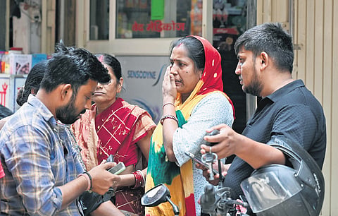 Family members of victims of the fire incident that occurred in Tughlakabad Extension area on Friday 