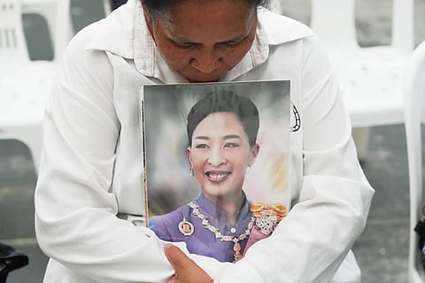 A person holds the picture of the late Thailand princess  Bajrakitiyabha Mahidol in Bangkok, Thailand, Friday, June 12, 2026.
