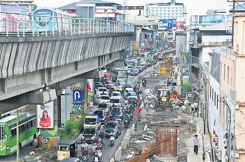 The congestion due to the ongoing metro works has prompted scammers to trick motorists into thinking they have violated traffic norms and exploiting this fear. A scene from Palarivattom on Friday 