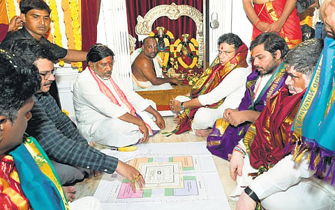 Deputy Chief Minister Bhatti Vikramarka looks at the blueprint for Satyanarayana Swamy temple renovation in Gudem in Mancherial district on Saturday