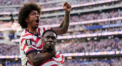 United States' Folarin Balogun celebrates scoring his side's third goal against Paraguay with teamate Chris Richards during the World Cup Group D soccer match in Inglewood, Calif., near Los Angeles, Friday, June 12, 2026. 