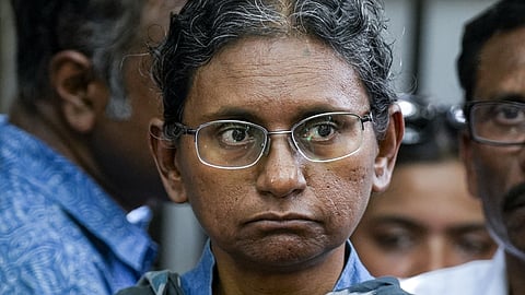 Congress leader Meenakshi Natarajan looks on during a press conference after a meeting with the Electi