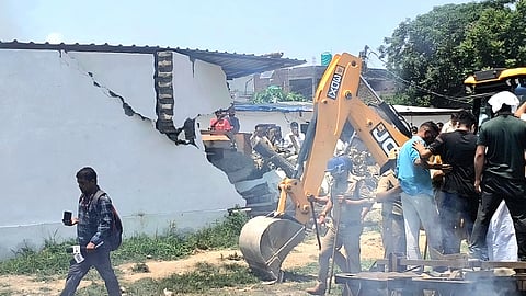 The administration initiated bulldozer action at the houses of the three arrested accused, citing illegal encroachment. 