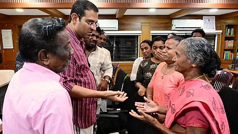 Higher Education Minister Roji M. John interacting with residents of Pariyathukavu, a Dalit settlement at Malayidamthuruth near Kizhakkambalam, during a meeting held at the Ernakulam district collectorate on June 13. 