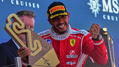 Ferrari driver Lewis Hamilton of Britain celebrates after wining the Spain F1 Grand Prix race at the Barcelona Catalunya racetrack in Montmelo, near Barcelona, Spain, Sunday, June 14, 2026.