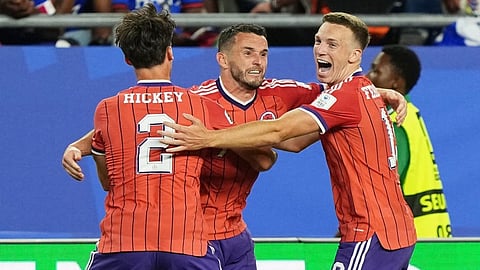 Scotland's John McGinn (7) celebrates with teammate's Aaron Hickey (2) and Lewis Ferguson (19) after scoring his teams first goal during the World Cup Group C soccer match between Haiti and Scotland on June 13, 2026. 