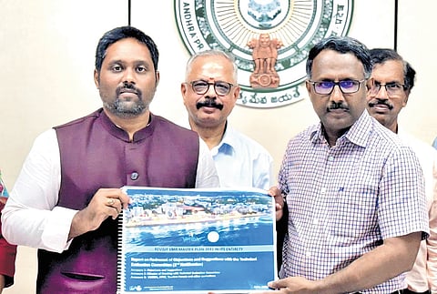 VMRDA Commissioner N Tej Bharath submits a revised Master Plan - 2041 to MA&UD  Principal Secretary S Suresh Kumar at the Secretariat in Velagapudi 
