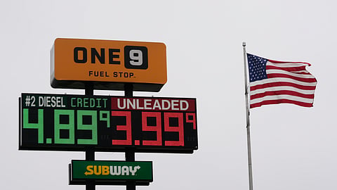 The American Flag flies next to a One9 Fuel Stop sign displaying gas prices for diesel and unleaded gas in Wilmington, Ohio, Wednesday, June 10, 2026