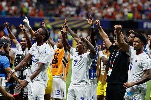 Cape Verde players rejoice after the match against Spain)
