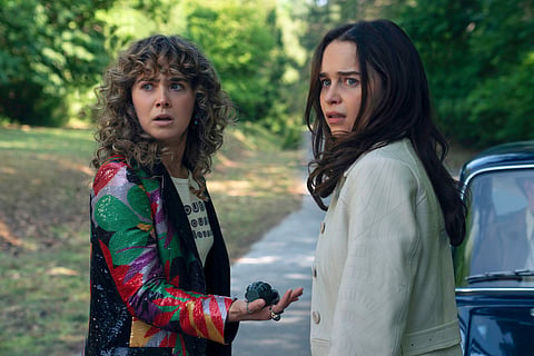 This image released by Peacock shows Emilia Clarke, left, and Haley Lu Richardson in a scene from "Ponies."