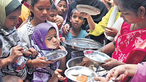 Schoolchildren served breakfast under the government’s Breakfast with Milk scheme at Musheerabad Government Primary School  