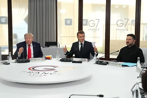 From left, US President Donald Trump, French President Emmanuel Macron and Ukrainian President Volodymyr Zelenskyy during a working session at the G7 summit in Evian-les-Bains, France, Tuesday, June 16, 2026. 