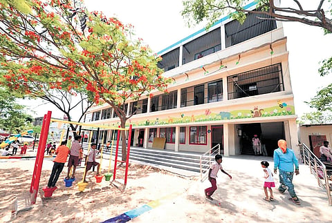 Children walk by the Telangana Public School building, which will be inaugurated by Chief Minister A Revanth Reddy on Wednesday