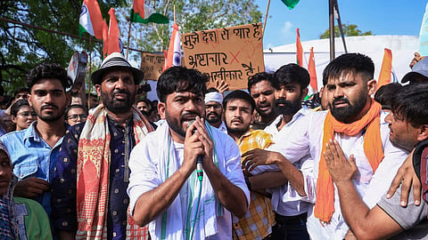 CJP leader Abhijeet Dipke along with party supporters stage a protest against Union Education Minister Dharmendra Pradhan over the alleged NEET-2026 examination paper leak, at Shaheed Smarak, in Jaipur, Rajasthan, Monday, June 15, 2026.