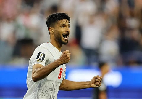 Iran’s Mohammad Mohebbi celebrates scoring their second goal. 