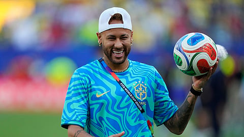 Brazil's Neymar (10) looks on before the World Cup Group C soccer match between Brazil and Morocco in East Rutherford, N.J.