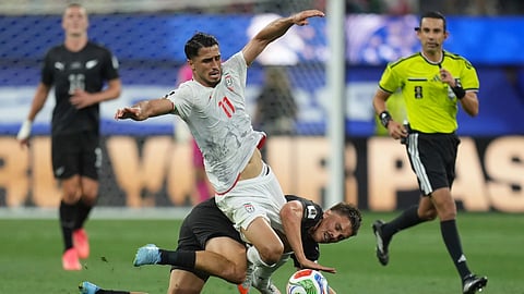 Iran's Ali Alipour (11) battles for the ball with New Zealand's Ryan Thomas (23) during the World Cup Group G soccer match between Iran and New Zealand in Inglewood, Calif., near Los Angeles, Monday, June 15, 2026.