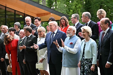 Leaders of G7 countries and invited partners pose for a family photo during a gala dinner on the sidelines of the G7 summit in Évian-les-Bains